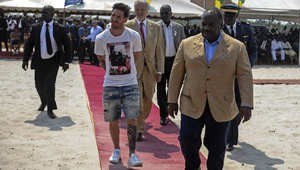 Argentinian soccer player and four-time FIFA Ballon d'Or winner Lionel Messi (C) is given a tour during the start of construction of the Port-Gentil Stadium by the President of Gabon, Ali Bongo Ondimba (R) in the Ntchengue district of Port-Gentil on July 18, 2015. Gabon will host the 2017 Africa Cup of Nations soccer tournament. AFP PHOTO / STEVE JORDAN        (Photo credit should read Steve Jordan/AFP/Getty Images)