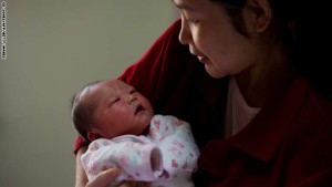 Yu Qiuyan (R) holds her newborn baby girl Li Muhua in her room at the Antai maternity hospital in Beijing on January 26, 2012. As China welcomes the year of the dragon -- considered to be the most auspicious zodiac symbol in the Chinese lunar calendar -- the country  is expecting a five percent increase in the number of babies born in 2012, state-run news agency Xinhua recently reported. Similar increases in birth rates are expected in Taiwan and Hong Kong with would-be parents keen to capitalise on the good fortune, intelligence, and success that dragon-babies are believed to inherit. AFP PHOTO / Ed Jones (Photo credit should read Ed Jones/AFP/Getty Images)