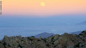 JACUMBA, CA - OCTOBER 06:  The full Harvest Moon marks the Autumnal Equinox as it rises over a landscape made up entirely of huge rock formations which comprises the remote desert mountains bisected by the US-Mexico border on October 6, 2006 near the Valley of the Moon, east of Jacumba, California. US Fish and Wildlife Service wardens and environmentalists warn that a proposed plan to construct 700-miles of fencing along the 2,000-mile US-Mexico border in an attempt to wall-out illegal immigrants would also harm rare wildlife. Scores of species from cactus-pollinating insects that would fly around the fence lights instead pollinating cacti; many birds that migrate by starlight in the darkness of the desert wilderness would be confused; and large mammals such as onetime US-resident jaguars, Mexican wolves, Sonoran pronghorn antelope, and desert bighorn sheep would be blocked from migrating across the international border, from California to Texas.(Photo by David McNew/Getty Images)