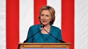 FILE - In this Friday, July 31, 2015, file photo, Democratic presidential candidate, former Secretary of State Hillary Rodham Clinton, calls on Congress to end the trade embargo the U.S. has imposed against Cuba since 1962, during a campaign stop at Florida International University in Miami. Clinton is airing the first television ads of her presidential race, which are scheduled for Tuesday, Aug. 4, 2015. (AP Photo/Gaston De Cardenas, File)