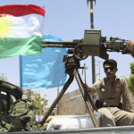 A military convoy drives towards Kirkuk, to reinforce Kurdish Peshmerga troops in Kirkuk, in this photograph taken through a window June 24, 2014. U.S. Secretary of State John Kerry urged leaders of Iraq's autonomous Kurdish region on Tuesday to stand with Baghdad in the face of a Sunni insurgent onslaught that threatens to dismember the country. Picture taken June 24, 2014. REUTERS/Yahya Ahmad (IRAQ - Tags: CIVIL UNREST POLITICS MILITARY CONFLICT) - RTR3VMMK